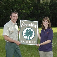 TFS FORESTER PRESENTS A CERTIFIED FOREST STEWARD AWARD TO A LANDOWNER